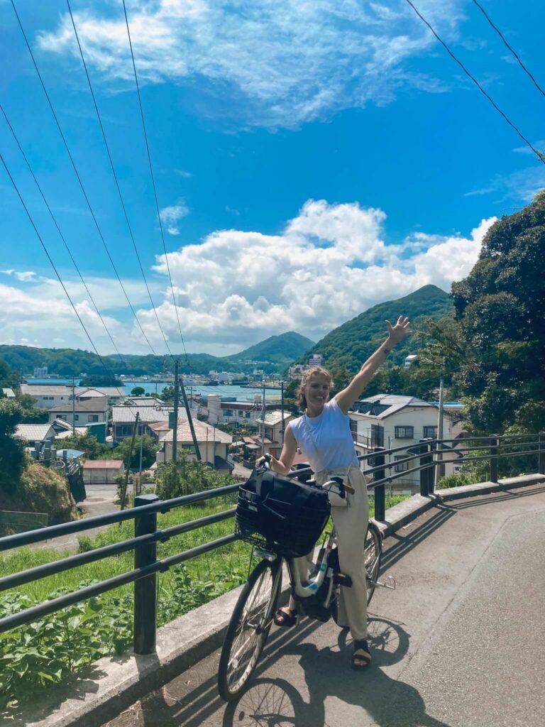 girl riding a bike in a fishing town of Shimoda in Shizuoka prefecture